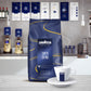 Lavazza Super Crema coffee bag with a cup on a kitchen counter