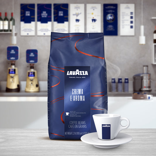 Lavazza Crema E Aroma bag, sitting in front of a Lavazza coffee cup