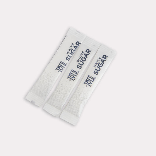 Set of three white sugar packets with black text on a white background
